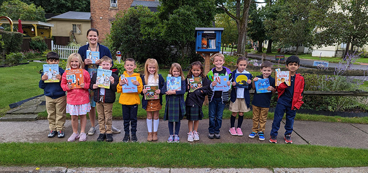 Holy Family students give back with book donation